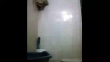 Young bhabhi with a sexy big ass makes a video while taking a bath